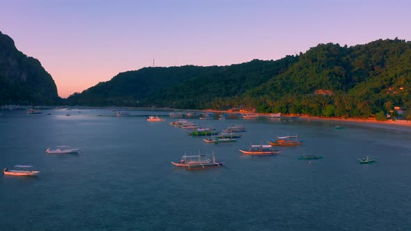 Sail Boats at Sunset on the Sea Lagoon on Corong Beach in El Nido, Palawan, Philippines alt