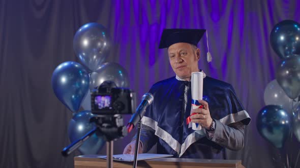 Diploma Online Nice University Teacher Congratulates Graduates By Video Link Standing at Chair in alt