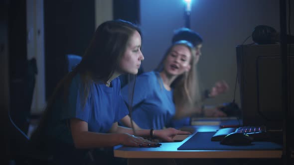 Group of Friends Walks in Gaming Club and Sits By the Computers alt