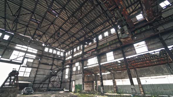 Ruined roof of an old abandoned factory. Industrial building for demolition. alt