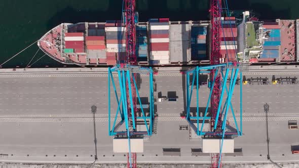 Drone Flying Over a Container Ship During Cargo Operations Over the Customs Area alt