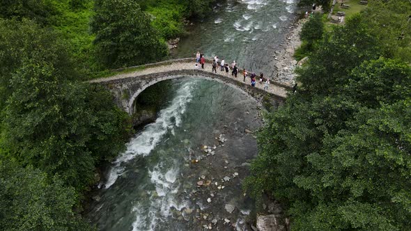 Stone Arch Bridge And People alt