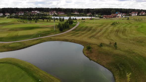 Drone Flies Over a Golf Course alt