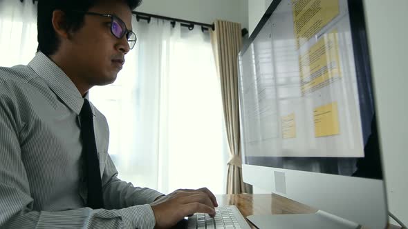 Business man  typing on a  computer keyboard in the room, working and pressing on keyboard