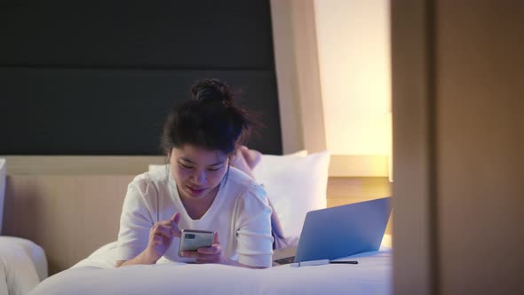 asian female Woman casual cloth working with laptop on hotel