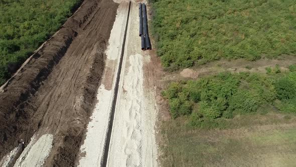 Aerial view of gas and oil pipeline construction. Pipes welded together alt