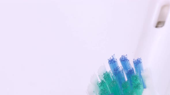 Close up view of electric toothbrush heads, macro shot in 4k. Rotating motion of used electric tooth alt