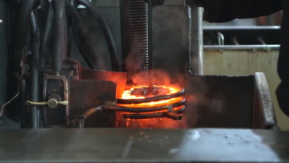 Hardening and Heat Treatment of the Metal Gear of the Part on the Equipment for Hardening of Metal alt