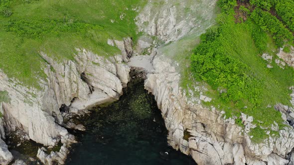 View From a Drone Vertically Down on the Rocks of Cape Kuzmin alt