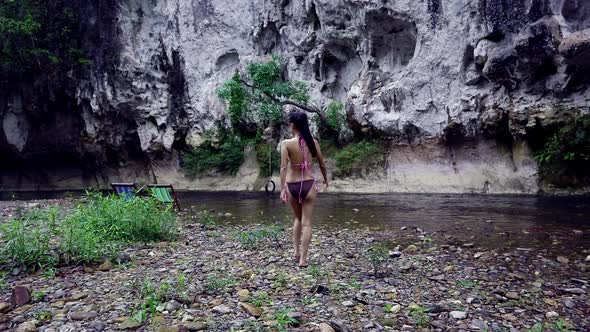 Cute Asian Girl Walking in Bikini Towards the River Thailand