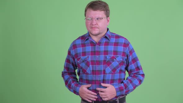 Stressed Overweight Bearded Hipster Man Having Stomachache alt