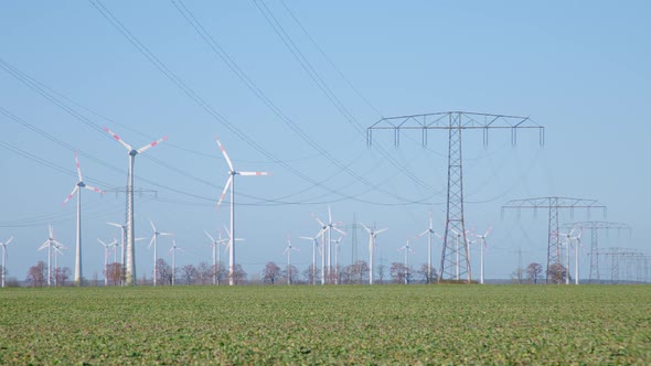 Time lapse Energy Landscape with Wind Turbines and Electricity Pylon alt