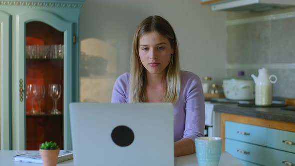 Young Woman is Working with Laptop Then Resting at Table in Apartment Room Rbbro alt