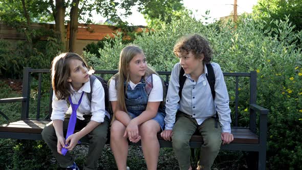 Three Schoolchildren Taunt Their Classmate. School Bullying alt