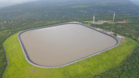 Aerial view of Lam Takhong Dam, Korat, Thailand. Reservoir dam and water in recycle energy alt