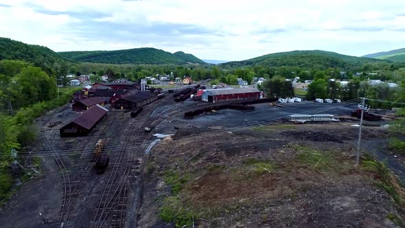 Aerial View of an Abandoned Narrow Gauge Coal Rail Road with Rusting Hoppers alt