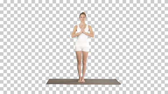 Young yoga woman meditating standing, Alpha Channel alt