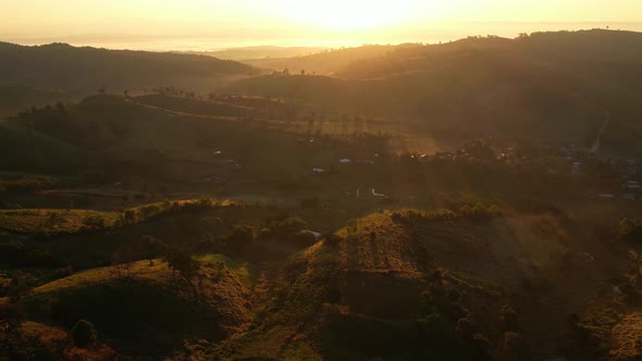 4K Flying through the clouds above mountain tops alt