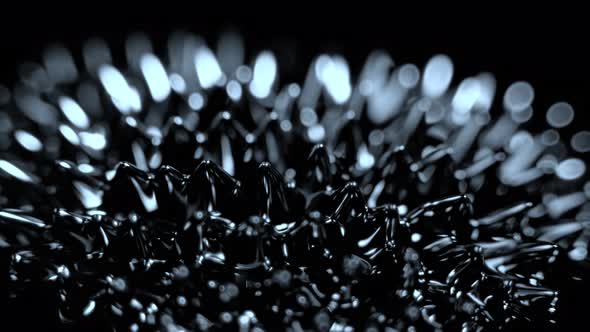 Super Slow Motion Macro Shot of Magnetic Liquid Ferrofluid in Motion at 1000Fps. alt