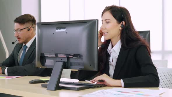 Business People Wearing Headset Working in Office alt