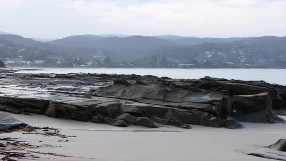 Lorne foreshore during sunset. Smoke from a fire haze fills the air along the costal town. SLOW MOTI alt