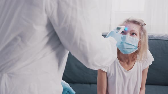 Doctor Measuring Temperature of an Elderly Woman alt