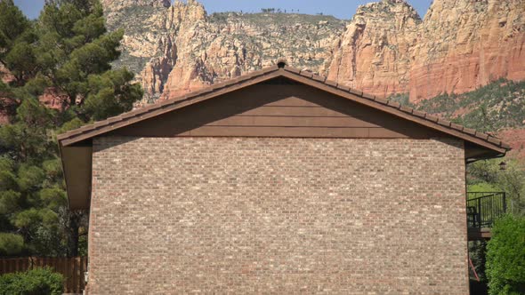 Hills behind a brick wall alt