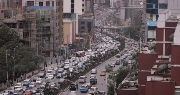 Heavy stream of traffic passing in downtown Addis Ababa, Ethiopia, Africa. alt