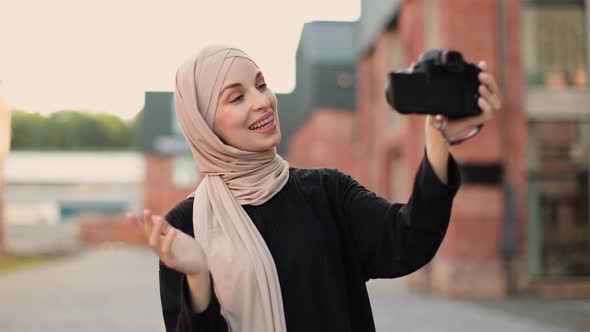 Arab Girl Takes Pictures of Herself on Camera Stock Footage VideoHive
