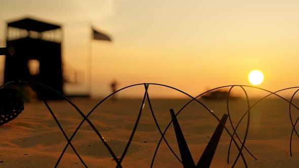 Border Area Barbed Wires and Sunset alt