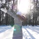 Happy Woman in Winter Clothes Throwing Handful of Snow and Enjoying Falling Snowflakes - VideoHive Item for Sale