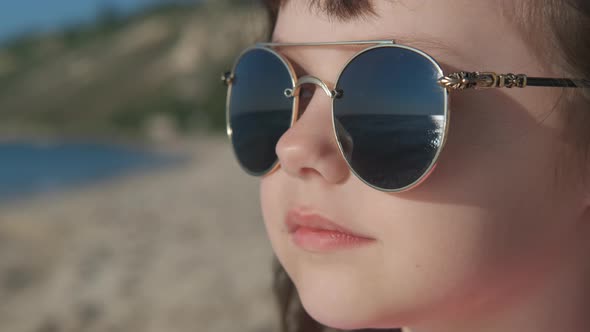 Wiew of sea in sunglasses.  alt