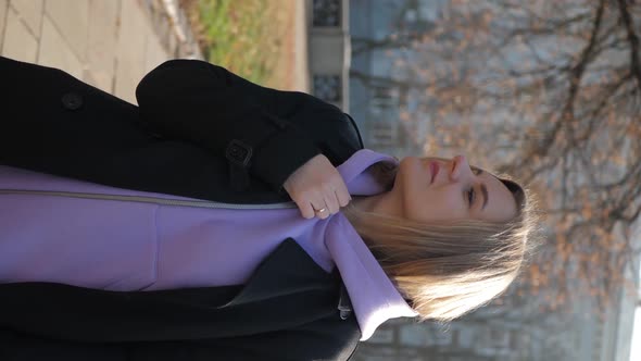 Vertical Video Woman Zipping Up alt