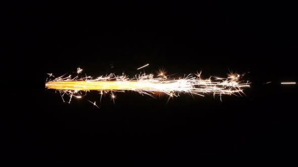 Flame With Sparks From Fireworks In The Horizontal Position