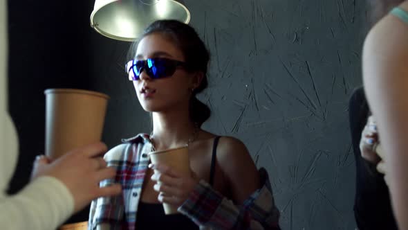 Group of Dancers Enjoy New Cool Music Mix Stand at Black Studio Background Wall