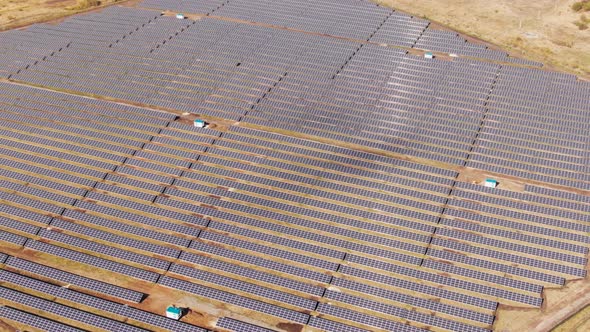 Dolly zoom aerial view of Solar Panels Farm solar cell with sunlight