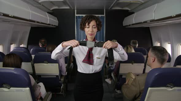 Airliner flight attendant explaining safety rules