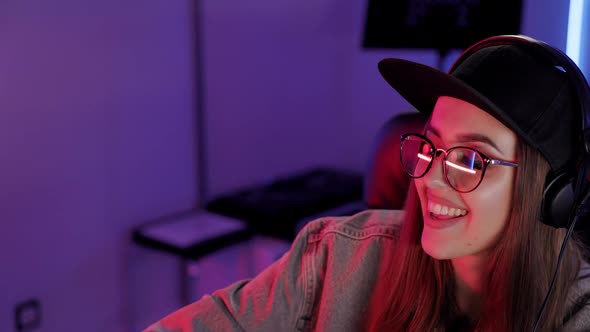 Close Up Portrait of Soundwoman in Designer Glasses Cap and Headphones Working in the Recording