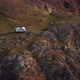 RV Camper Van on Mountains Landscape Near High Cliff Aerial Shot - VideoHive Item for Sale