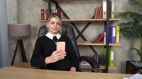 A Beautiful Girl Works In The Office, A Girl With A Phone, A Blonde Works, A Girl Makes A Selfie