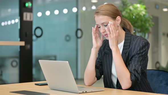 Stressed Businesswoman with Laptop Having Headache in Office  alt