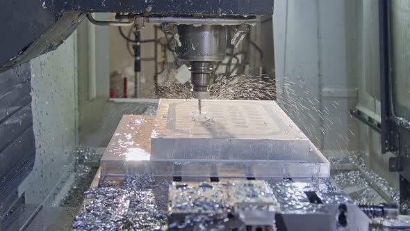CNC mill manufacturing an advanced metal part with liquid cooling
