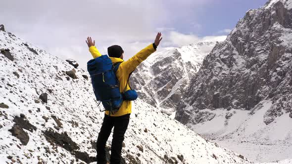 Young Hiker On Mountain Peak At Sunset Successful Pose Outstretched Arms Business Life Achievement alt