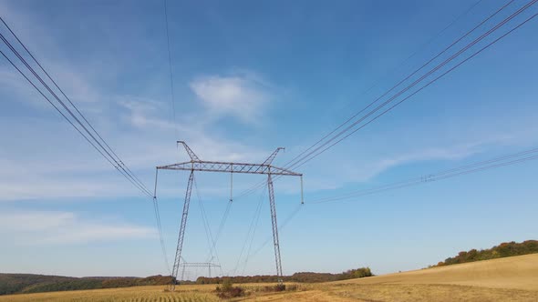 High Voltage Tower with Electric Power Lines Transfening Electrical Energy Through Cable Wires alt