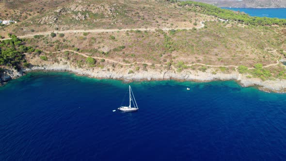 Drone Over Yacht Off Coastline Of Cap De Creus alt