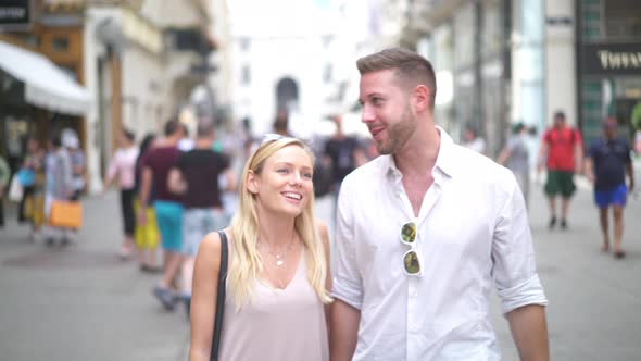 Young Couple Walking in Pedestrian Zone in City