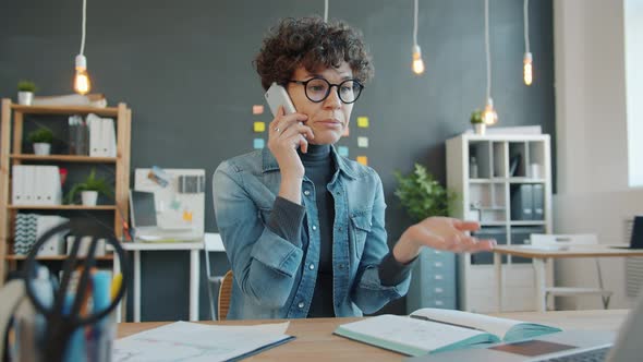 Slow Motion of Mad Girl Yelling in Mobile Phone at Work Discussing Business Problem alt