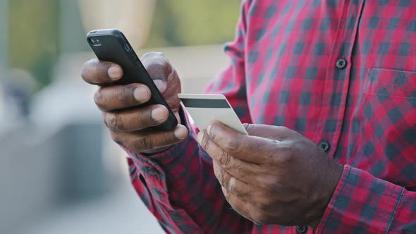 Crop Closeup of African American Man Shopping Online on Cellphone Pay with Credit Card alt