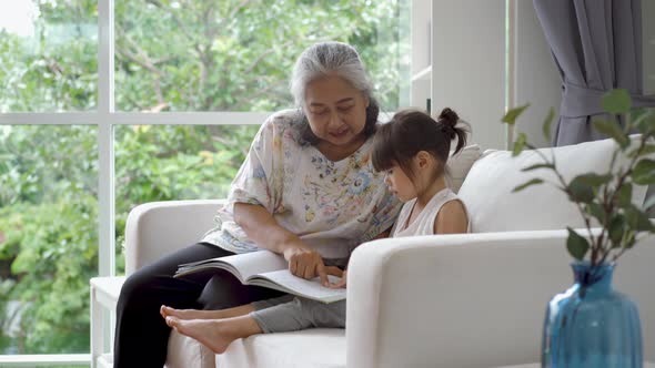 Elderly Asian Woman Teaching Her Granddaughter 04 alt