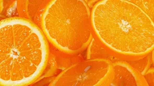 Super Slow Motion Shot of Flying Fresh Orange Slices Towards Camera at 1000 Fps alt